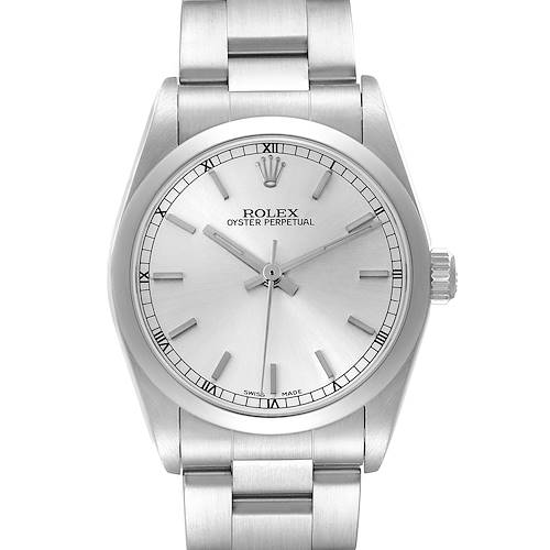 The Rolex Oyster Perpetual Mid-Size watch is shown from a front angle, displaying its face, bezel, and bracelet.